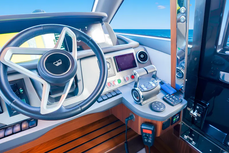 Slide: The Image of Steering wheel and controls of 2022 Princess F62 yacht, with ocean view. - 29