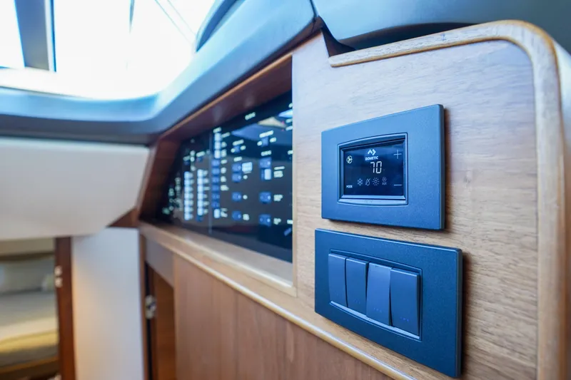 Slide: The Image of Control panel on 2022 Princess F62 yacht, featuring modern digital display and switches. - 32