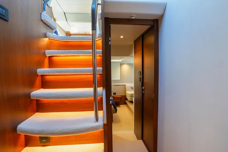 Slide: The Image of Luxurious interior of 2022 Princess F62 yacht with illuminated staircase and modern cabin. - 34