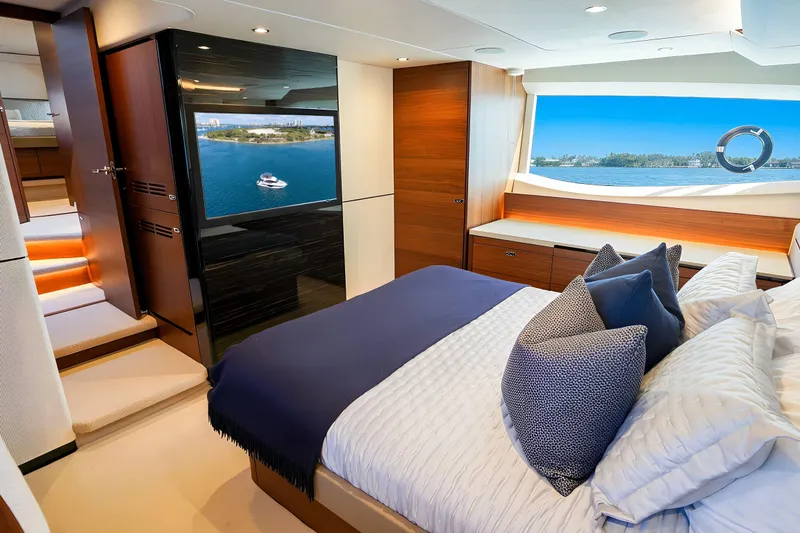 Slide: The Image of Luxurious 2022 Princess F62 yacht bedroom with scenic ocean view and modern decor. - 35