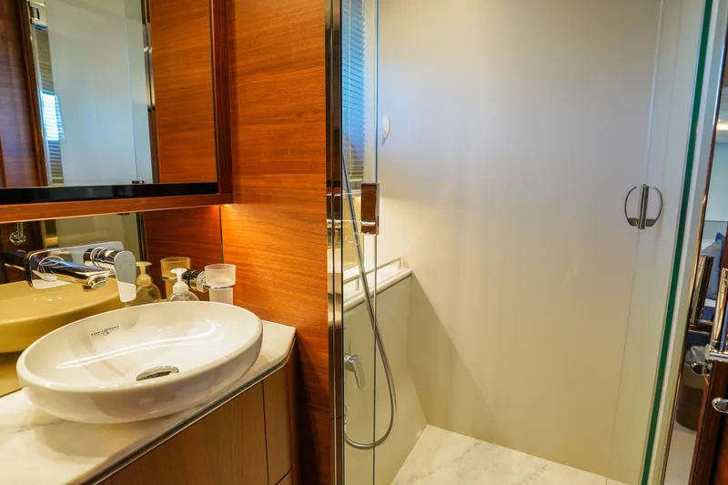 Slide: The Image of Luxurious bathroom in 2022 Princess F62 yacht with modern sink and shower. - 37