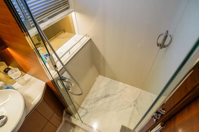 Slide: The Image of Luxurious bathroom in 2022 Princess F62 yacht with marble shower and modern fixtures. - 39