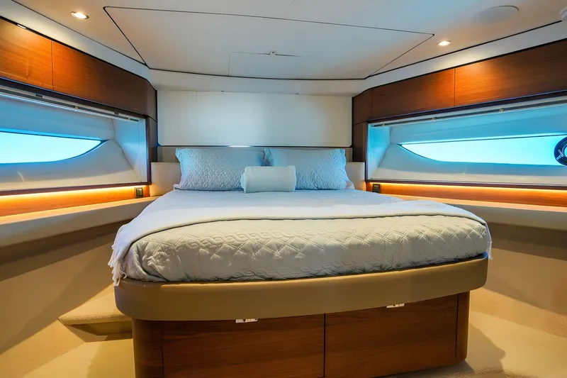 Slide: The Image of Luxurious bedroom interior of 2022 Princess F62 yacht with elegant bedding and ambient lighting. - 40