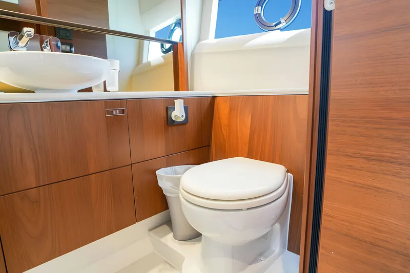 Slide: The Image of Luxurious bathroom in 2022 Princess F62 yacht with wooden cabinetry and modern fixtures. - 48