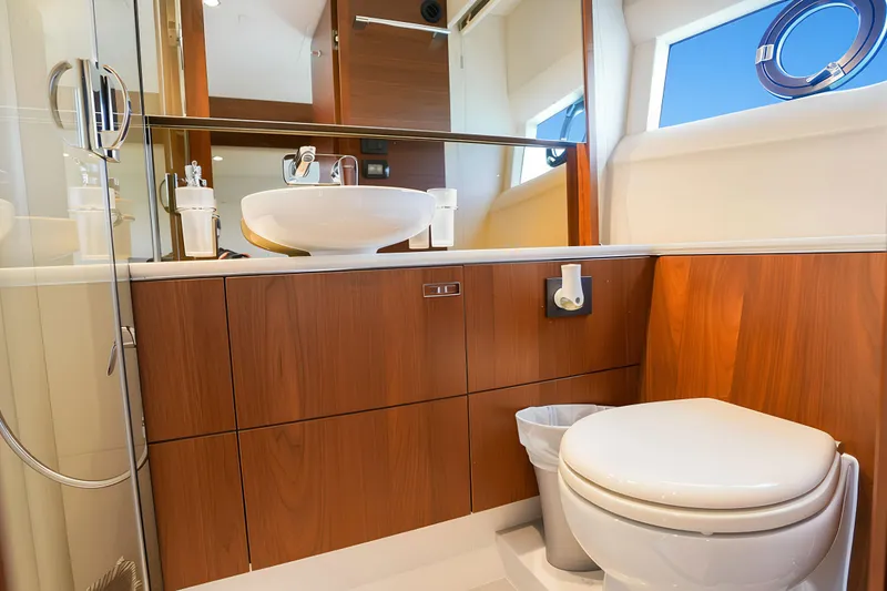Slide: The Image of Luxurious bathroom in 2022 Princess F62 yacht with modern fixtures and wooden cabinetry. - 49