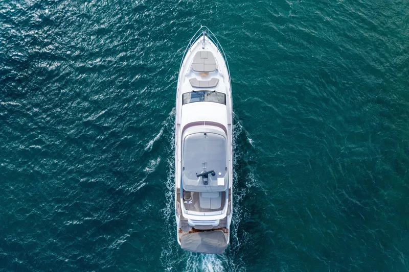 Slide: The Image of Aerial view of 2022 Princess F62 yacht cruising on blue ocean waters. - 5