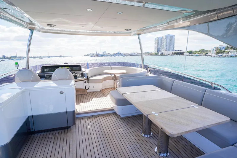 Slide: The Image of Luxurious 2022 Princess F62 yacht interior with elegant seating and ocean view. - 52
