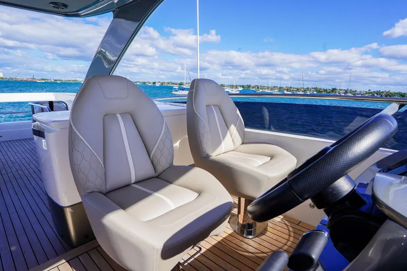 Slide: The Image of Luxurious 2022 Princess F62 yacht interior with plush seating and scenic ocean view. - 53