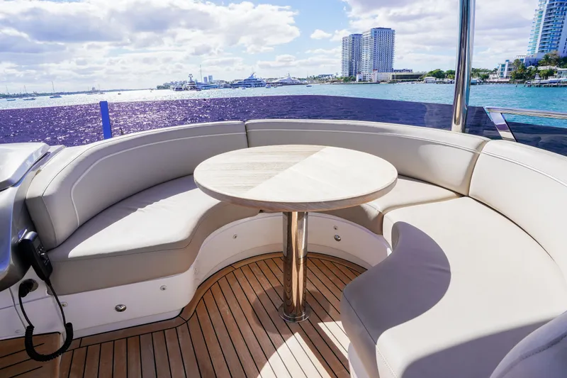 Slide: The Image of Luxurious seating area on 2022 Princess F62 yacht with ocean view and city skyline. - 55