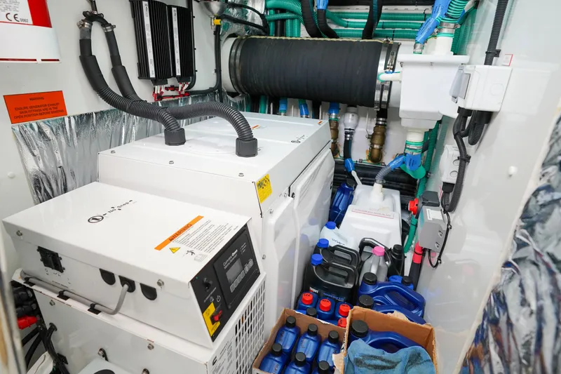 Slide: The Image of Engine room of 2022 Princess F62 yacht with equipment and maintenance supplies. - 60