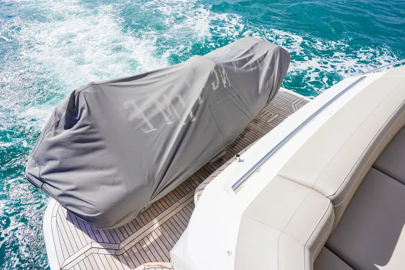Slide: The Image of Covered equipment on 2022 Princess F62 yacht deck, cruising on turquoise water. - 8