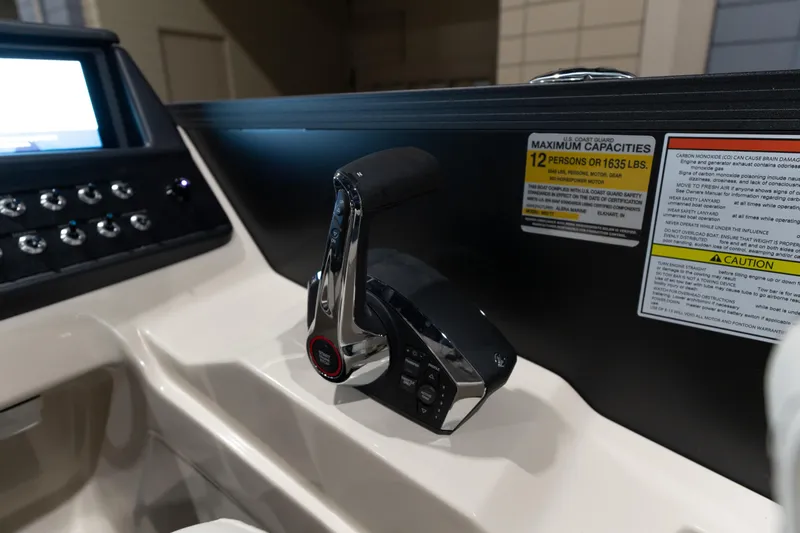 Slide: The Image of Control panel of 2026 Alera M23Q boat with capacity and safety warnings. - 17