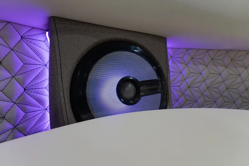Slide: The Image of 2026 Alera M23Q interior speaker with purple ambient lighting and geometric panel design. - 16