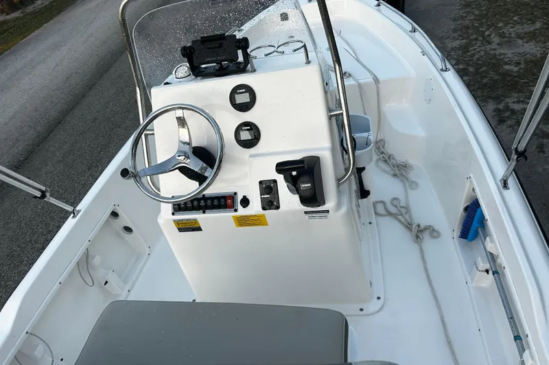 Slide: The Image of 2025 Key West 1720 Center Console boat interior with steering wheel and controls. - 5