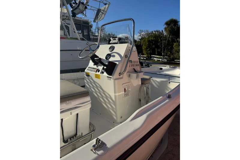 Slide: The Image of 2025 Key West 1720 Center Console boat interior with steering wheel and controls. - 8