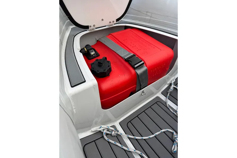 Slide: The Image of Highfield Classic 340 boat storage compartment with red fuel tank, 2023 model. - 11