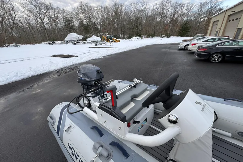 Slide: The Image of 2023 Highfield Classic 340 boat with Yamaha motor in snowy parking lot. - 13