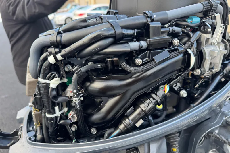 Slide: The Image of Close-up of a 2023 Highfield Classic 340 engine, showcasing intricate wiring and components. - 7