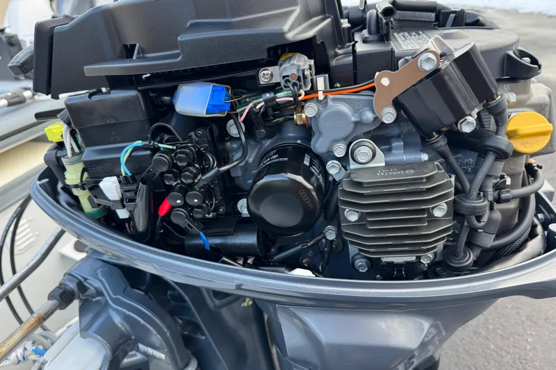 Slide: The Image of Close-up of a 2023 Highfield Classic 340 outboard motor engine components. - 9