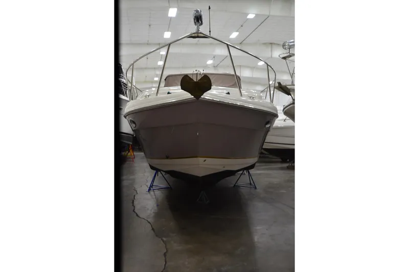 Slide: The Image of 2005 Rinker Fiesta Vee 342 boat in indoor storage, front view. - 11