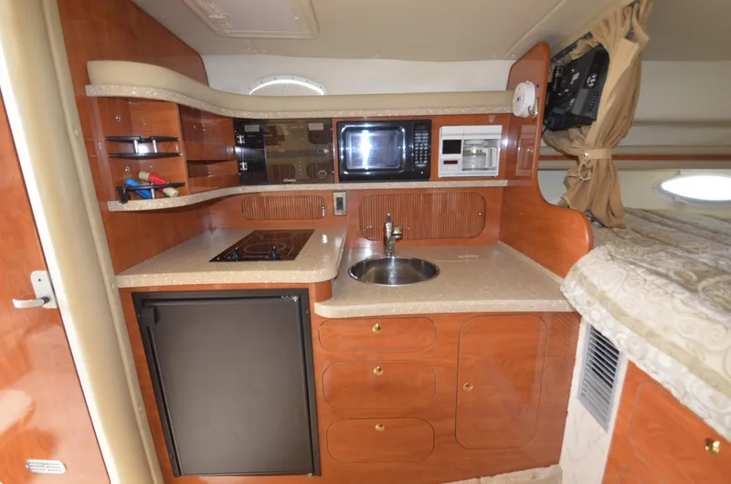 Slide: The Image of Interior of 2005 Rinker Fiesta Vee 342 yacht kitchen. - 12