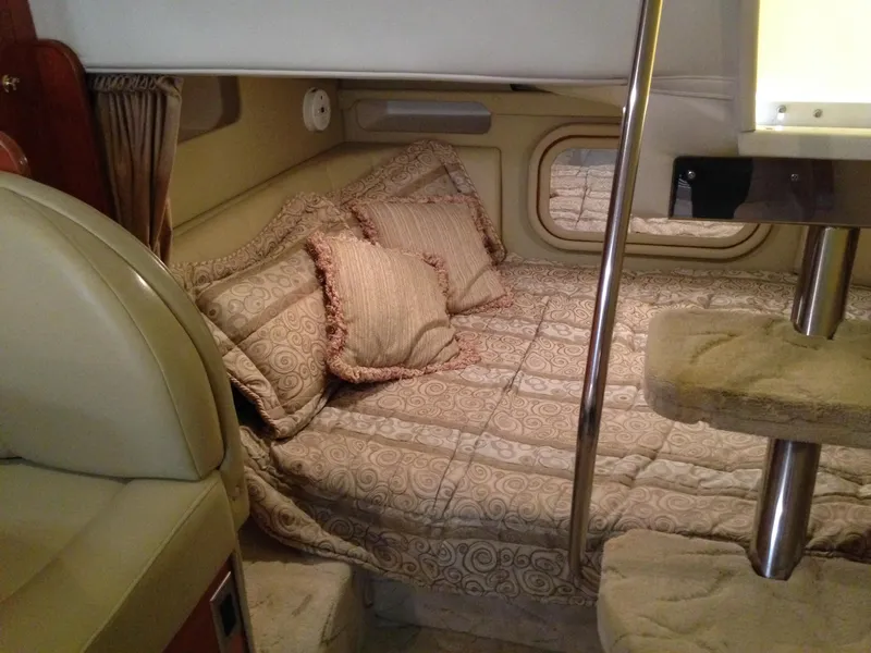 Slide: The Image of Interior of a 2005 Rinker Fiesta Vee 342 yacht with cozy bed. - 16