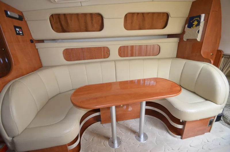 Slide: The Image of Interior of 2005 Rinker Fiesta Vee 342 yacht with leather seating area. - 18
