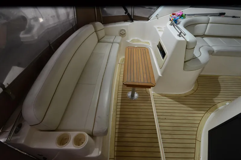 Slide: The Image of 2005 Rinker Fiesta Vee 342 interior with seating and wooden table. - 22