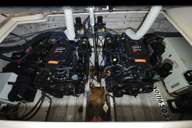 Slide: The Image of 2005 Rinker Fiesta Vee 342 engine compartment with dual MerCruiser 350 MAG MPI engines. - 34