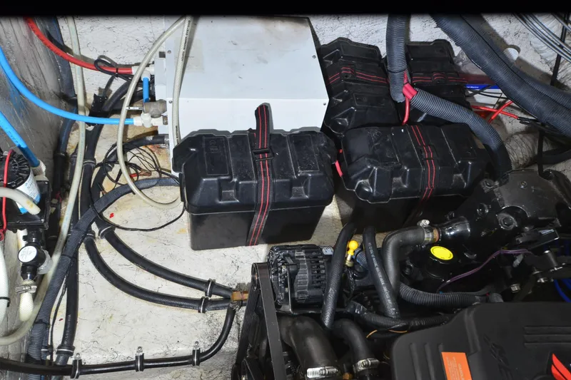 Slide: The Image of Engine compartment of 2005 Rinker Fiesta Vee 342 with batteries and wiring. - 38
