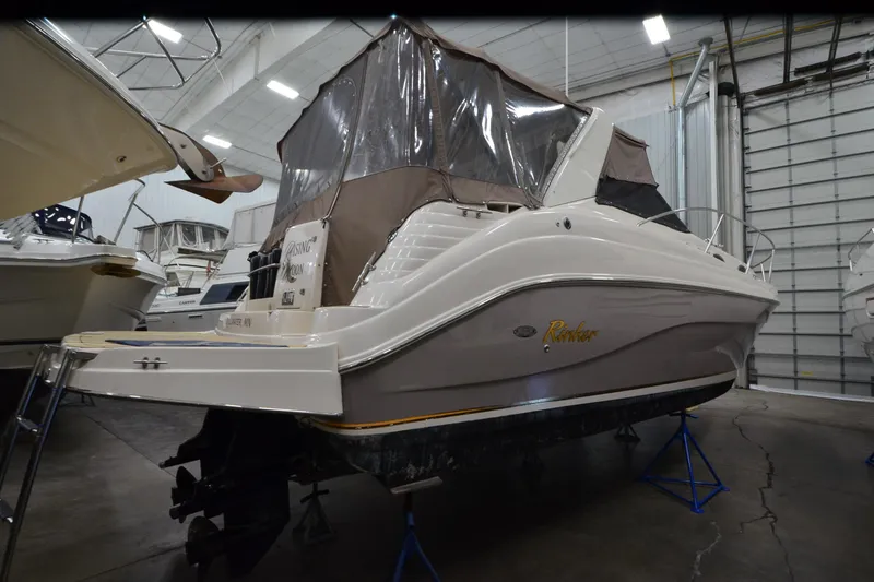 Slide: The Image of 2005 Rinker Fiesta Vee 342 boat in indoor storage, side view. - 4
