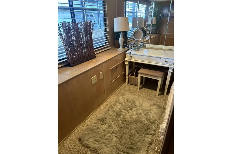 Slide: The Image of Cozy vanity area in 1996 Sumerset 82'x18' Widebody houseboat with plush rug and elegant decor. - 33