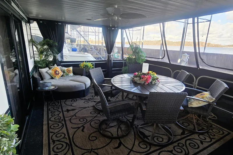 Slide: The Image of Luxurious 1996 Sumerset 82'x18' Widebody houseboat interior with elegant seating and decor. - 39