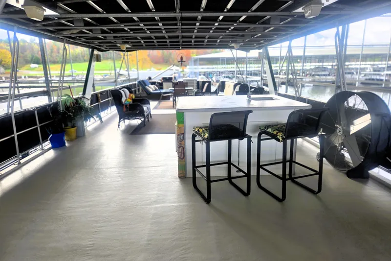 Slide: The Image of Spacious deck of 1996 Sumerset 82'x18' Widebody houseboat with seating and outdoor bar. - 43