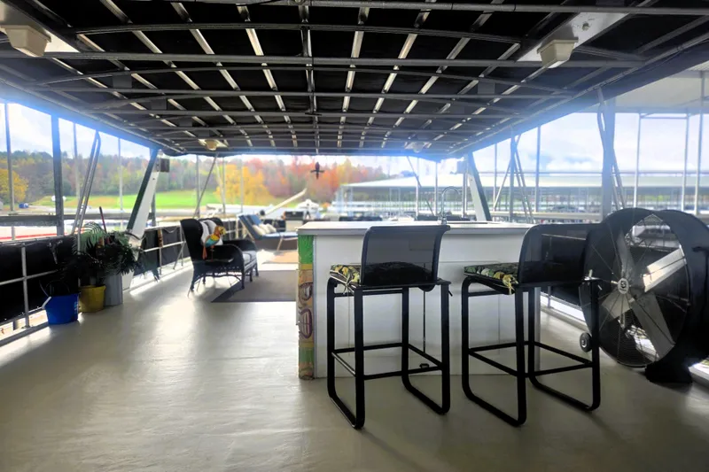 Slide: The Image of Spacious deck of 1996 Sumerset 82'x18' Widebody houseboat with seating and scenic view. - 44