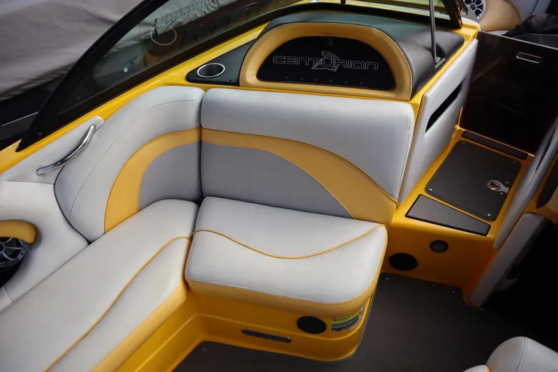 Slide: The Image of 2014 Centurion Enzo SS210 boat interior with yellow and gray seating. - 11