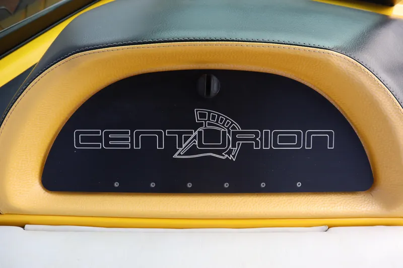 Slide: The Image of Centurion Enzo SS210 2014 boat interior with logo on yellow and black upholstery. - 13