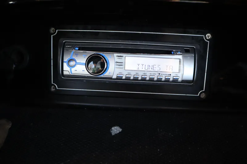 Slide: The Image of Clarion stereo system in 2014 Centurion Enzo SS210 boat dashboard. - 14