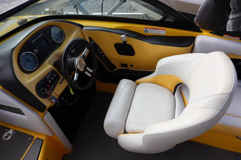 Slide: The Image of Interior of 2014 Centurion Enzo SS210 boat with yellow and white seating. - 15
