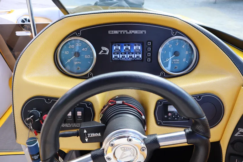 Slide: The Image of Dashboard of 2014 Centurion Enzo SS210 boat with steering wheel and gauges. - 16