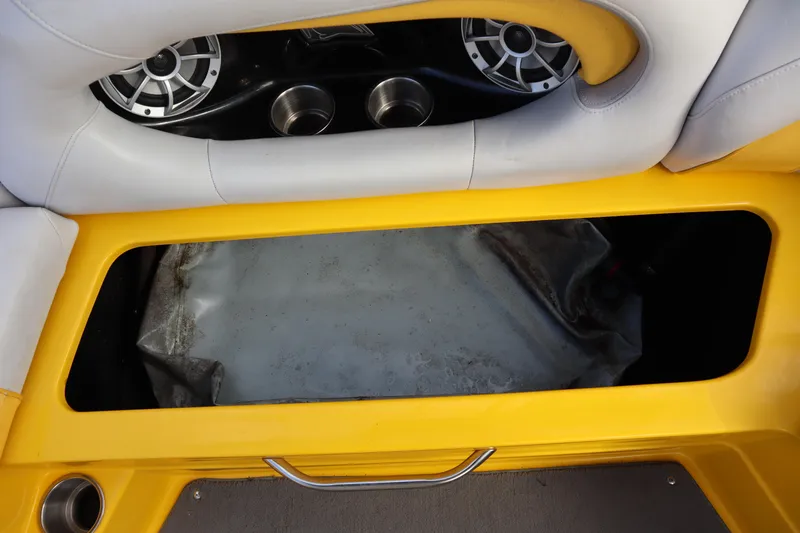 Slide: The Image of 2014 Centurion Enzo SS210 boat interior with yellow seating and built-in speakers. - 18