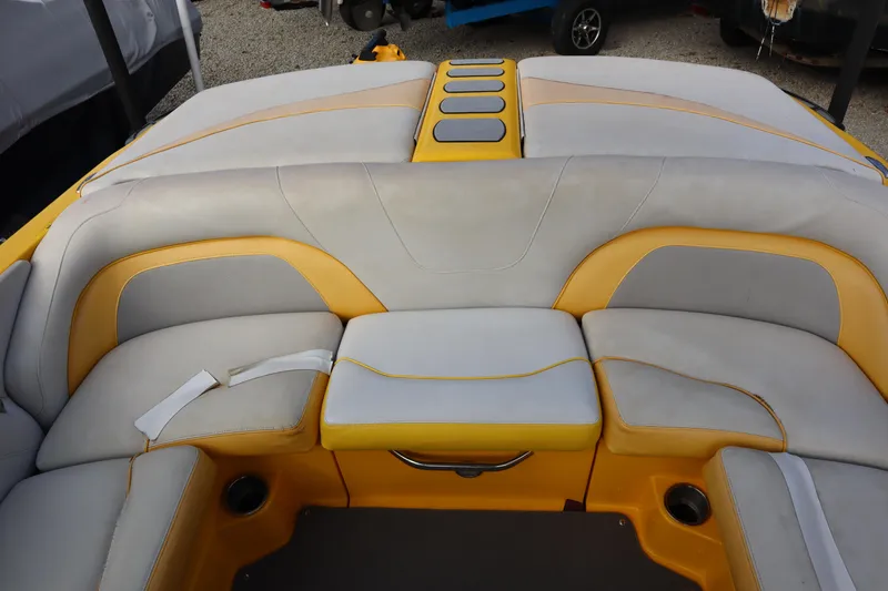 Slide: The Image of 2014 Centurion Enzo SS210 boat interior with yellow and gray seating. - 19