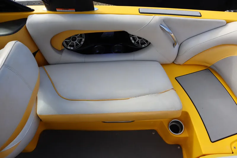 Slide: The Image of Yellow and white interior seating of 2014 Centurion Enzo SS210 boat with speaker system. - 22