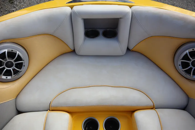 Slide: The Image of 2014 Centurion Enzo SS210 boat interior with speakers and cup holders. - 7