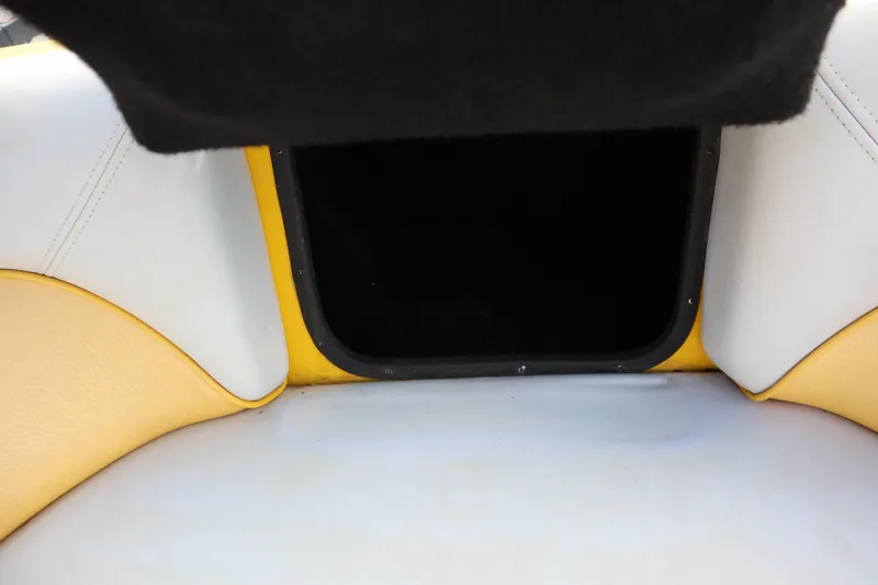 Slide: The Image of Interior storage compartment of 2014 Centurion Enzo SS210 boat with yellow and white upholstery. - 8