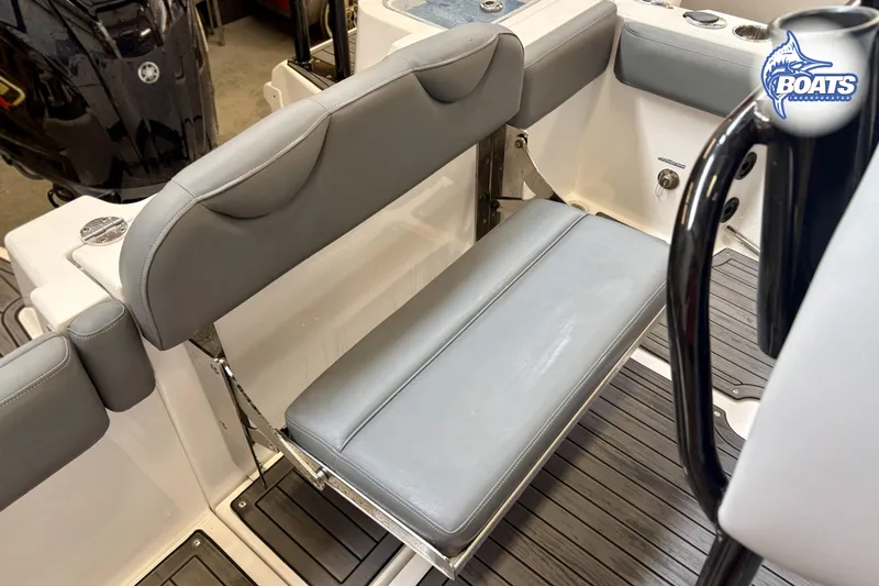 Slide: The Image of 2024 NauticStar 222 Offshore boat interior with gray seating and sleek design. - 11