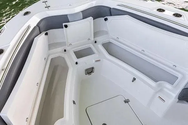 Slide: The Image of Manufacturer Provided Image: 2024 NauticStar 222 Offshore boat interior with storage compartments. - 4