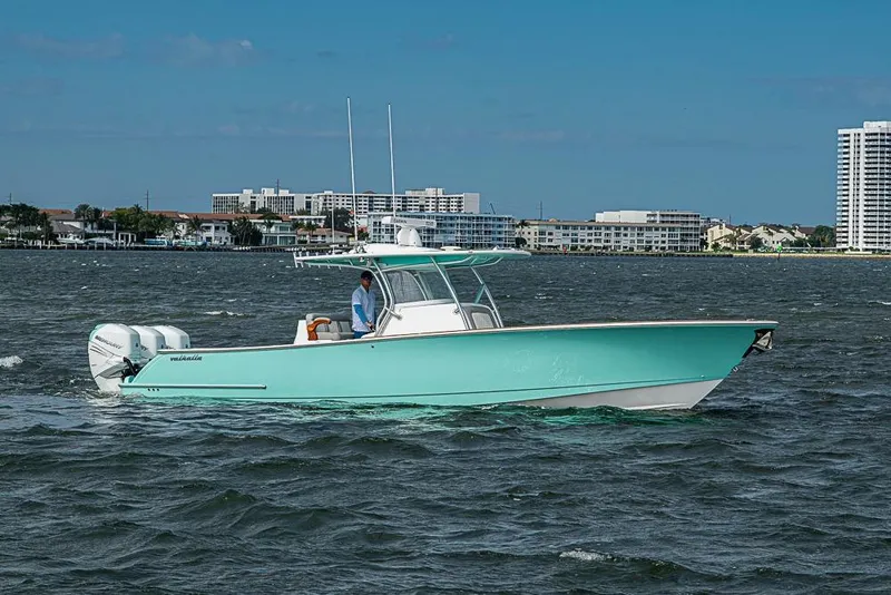 The Image of 2020 Valhalla Boatworks V-37 cruising on water with cityscape background. - 0