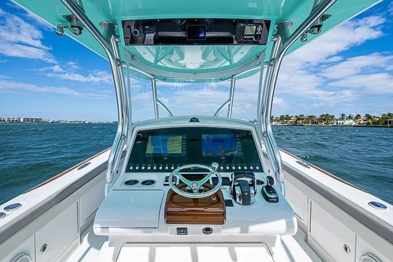 Slide: The Image of 2020 Valhalla Boatworks V-37 helm with advanced navigation system on open water. - 15