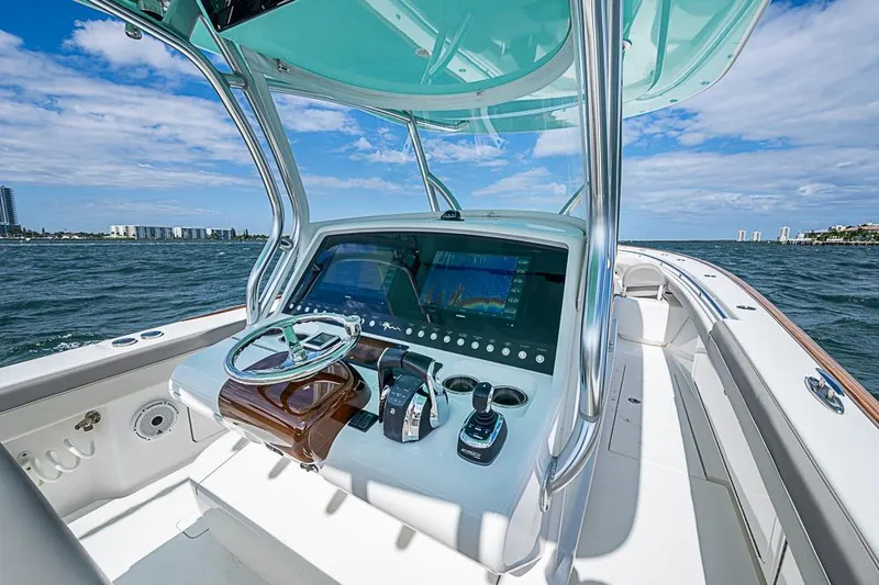 Slide: The Image of 2020 Valhalla Boatworks V-37 helm with advanced navigation system on open water. - 16